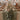 2026 event linen trends: champagne tablecloth with sage crinkle runner and terracotta napkins on a wedding banquet table