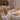 Budget-friendly wedding reception with white floor-length tablecloths, spandex chair covers, and warm string lights
