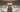 Banquet hall with white spandex wholesale chair covers and ivory tablecloths