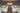 Banquet hall with white spandex wholesale chair covers and ivory tablecloths